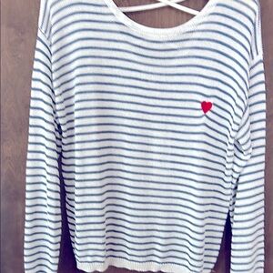 Molly Bracken (L) blue & white striped sweater with crisscross back. Red heart.